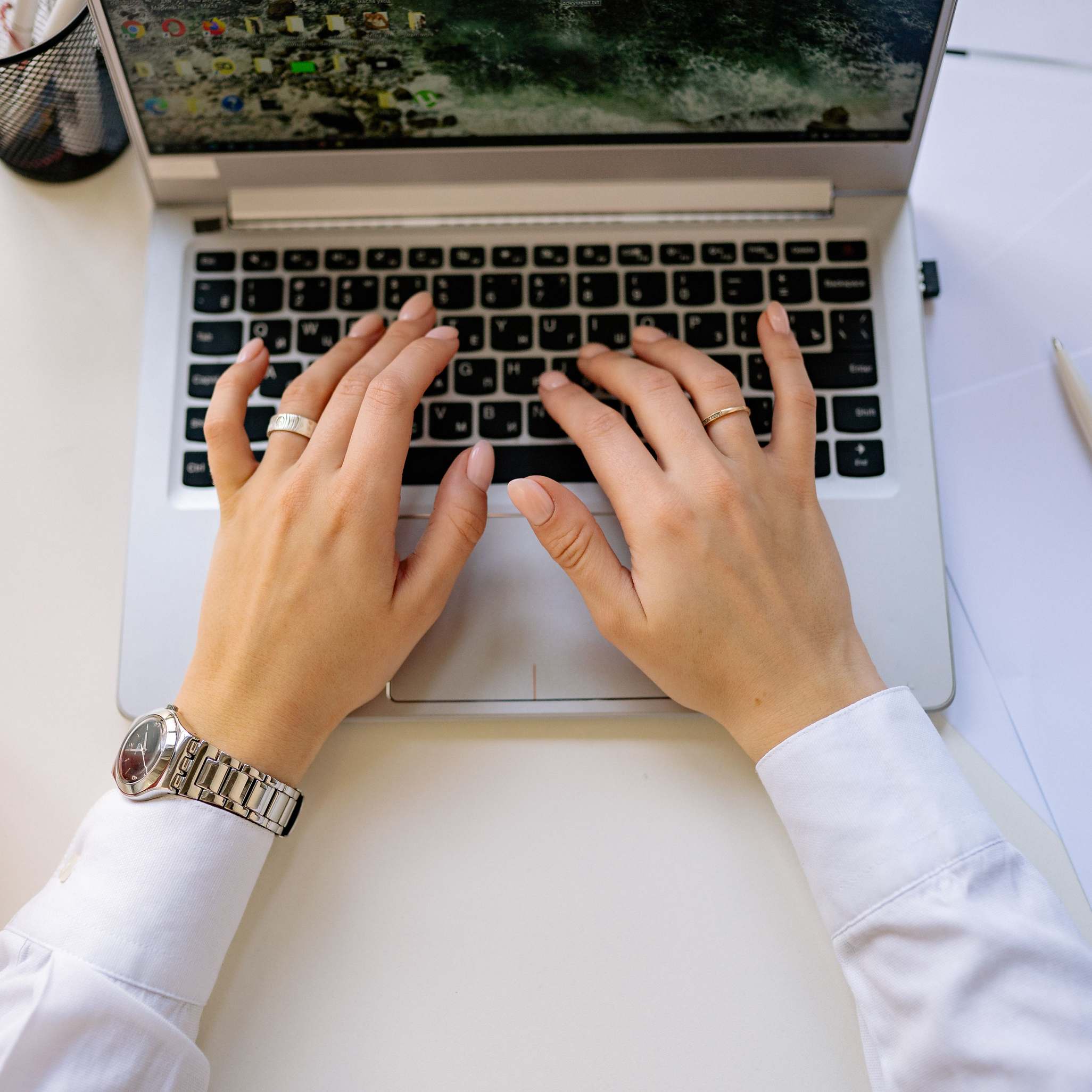 Hands on a keyboard during software debugging work